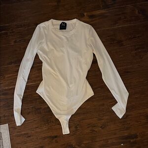 Naked Wardrobe Long Sleeve Bodysuit